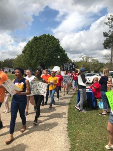 Student marchers with signs at the March for Our Lives in Mobile AL